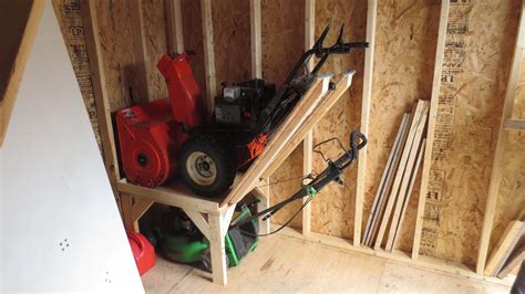 lawn mower storage in a garage